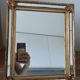 Miroir à pareclose doré