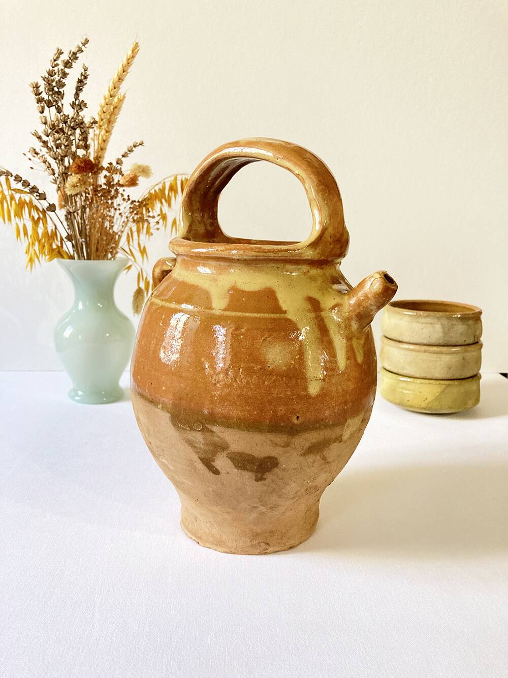 Old ochre and yellow glazed ceramic jug / goat