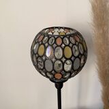 Table lamp with a vintage globe and a black base