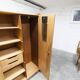 1950s Mid-Century Modern oak armoire with two doors and two drawers.