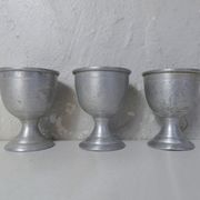 3 old aluminum shells