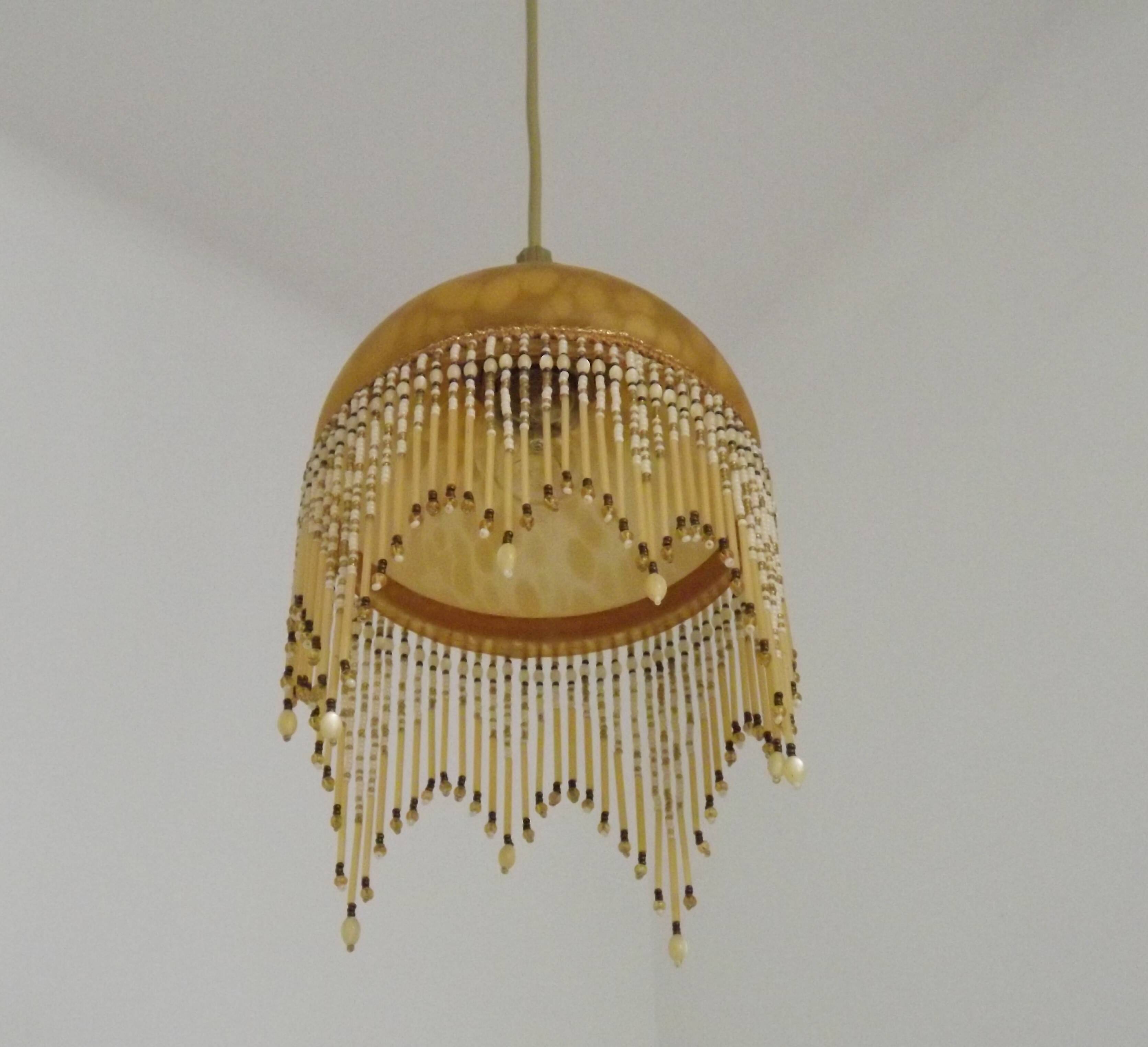 Vintage French amber mottled glass hanging ceiling light with beaded fringe.