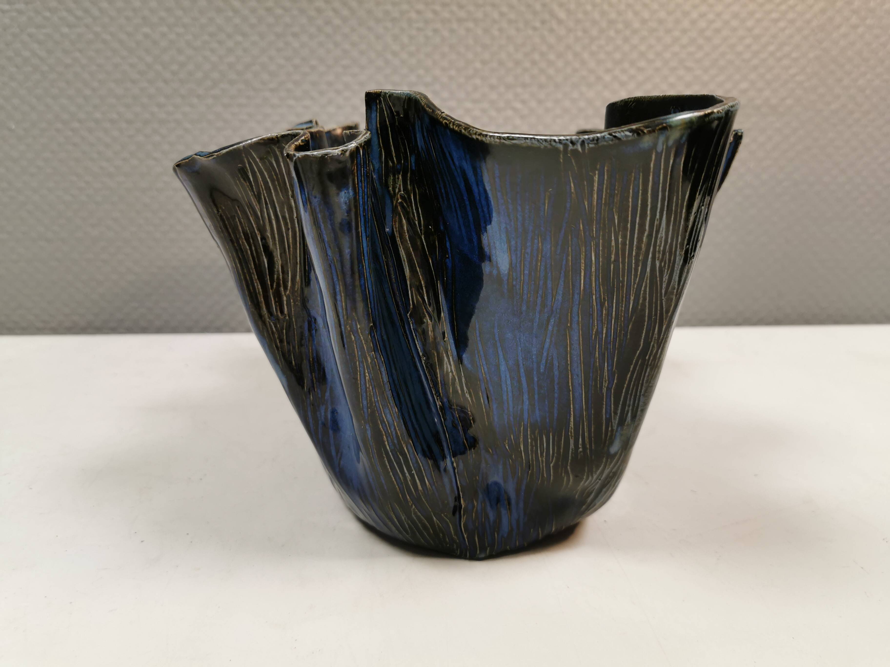 Very special vase in “folded” bluish glazed clay.