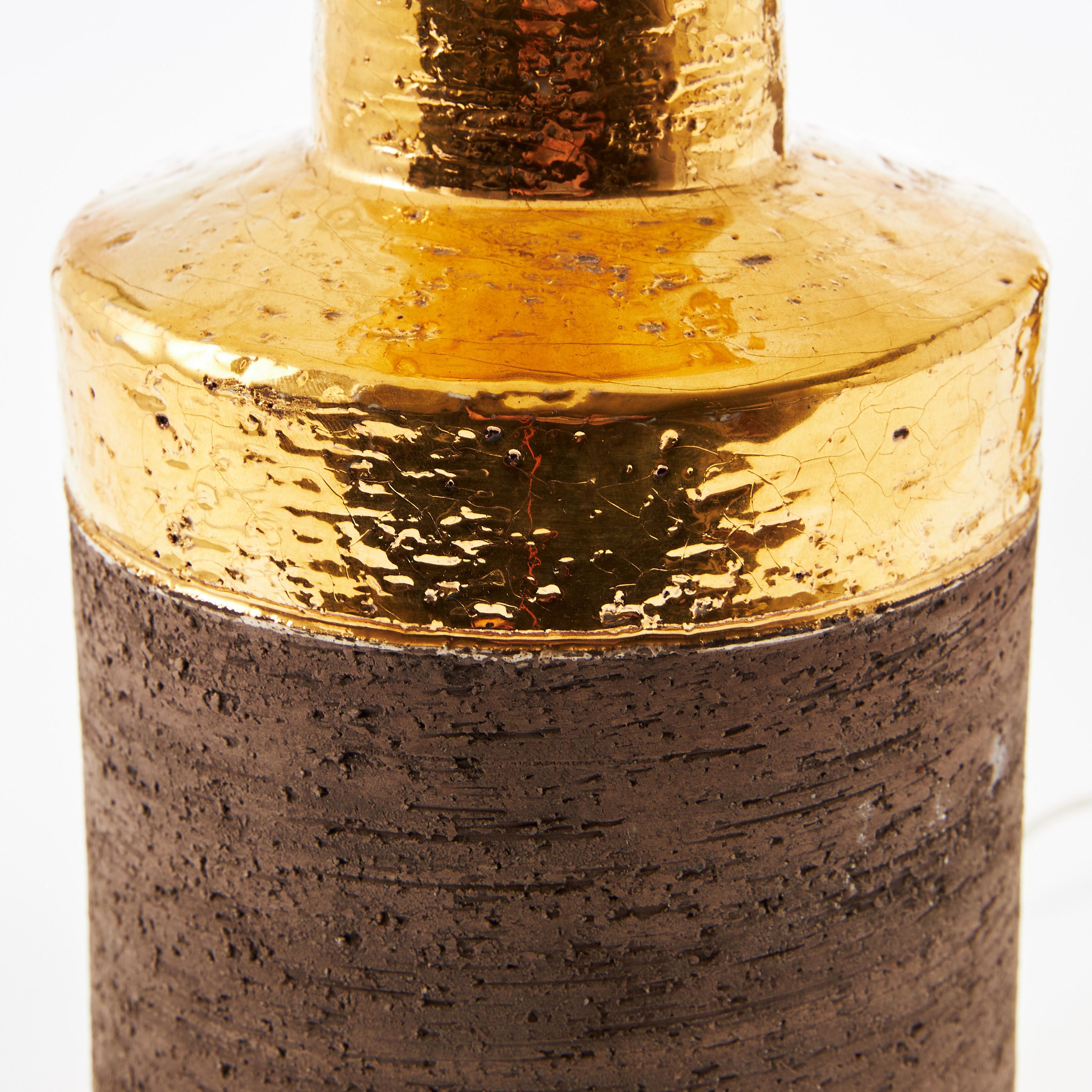Pair of Bitossi table lamps in gilded ceramic, Italy, 1970.