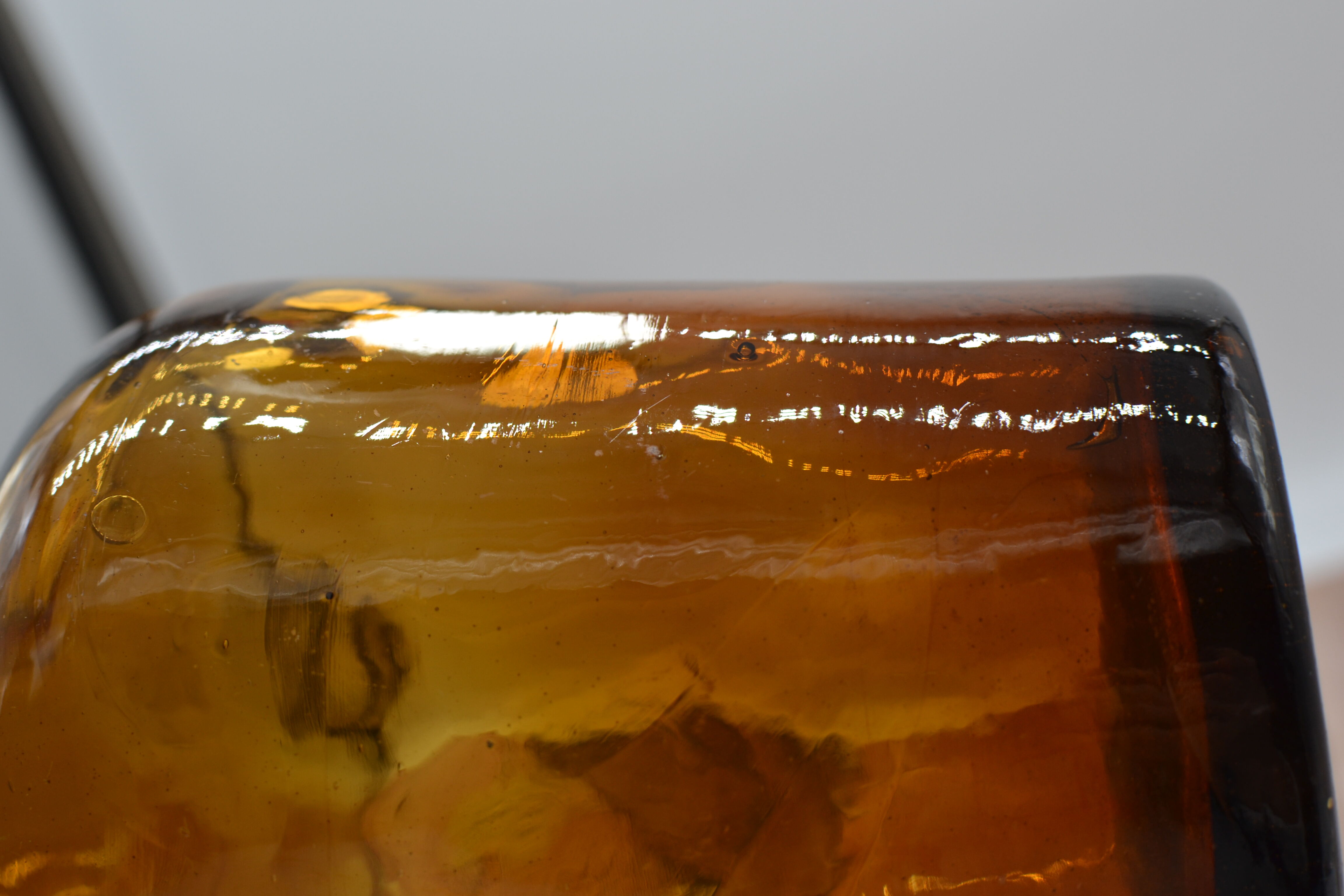 Lady jeanne in amber glass irregular appearance