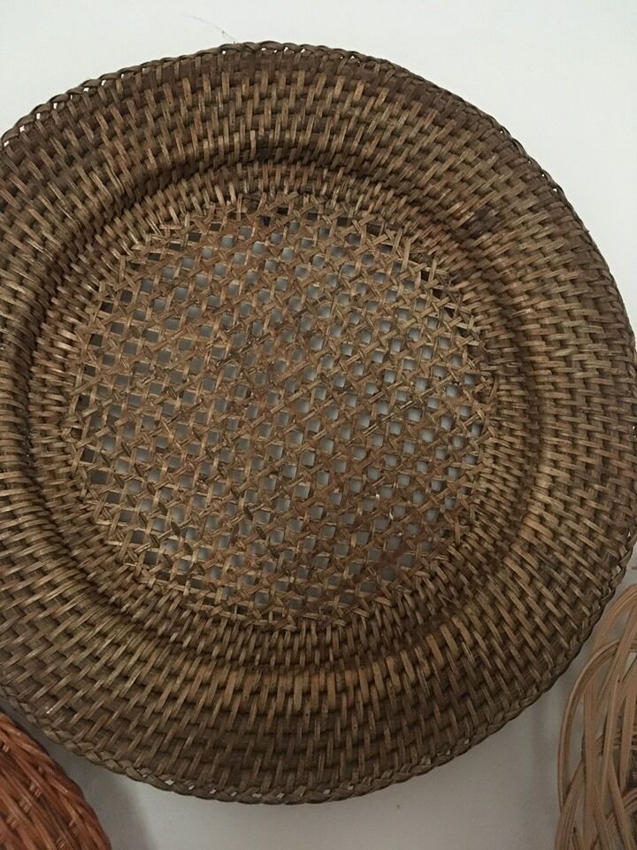 Wall composition of 8 baskets and wicker trays.