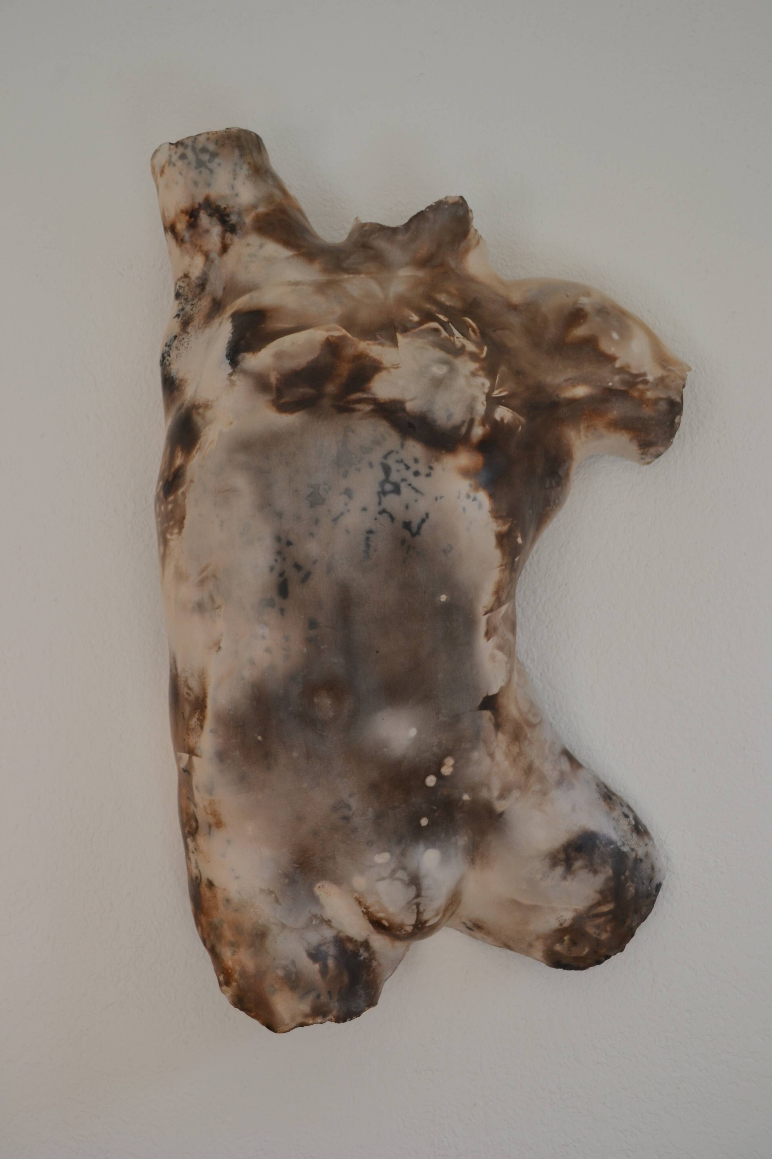 Male torso sculpture by patinated casting, signed to be identified.