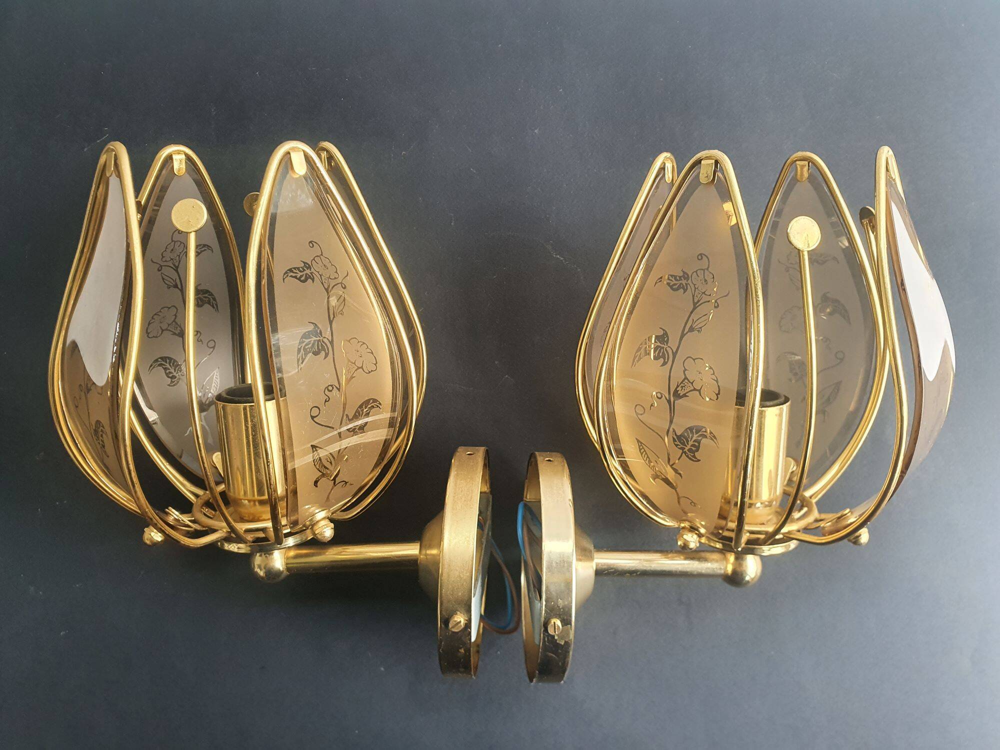 Pair of vintage brass wall sconces with glass shades