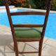 1 solid wood chair with green velvet top and nails