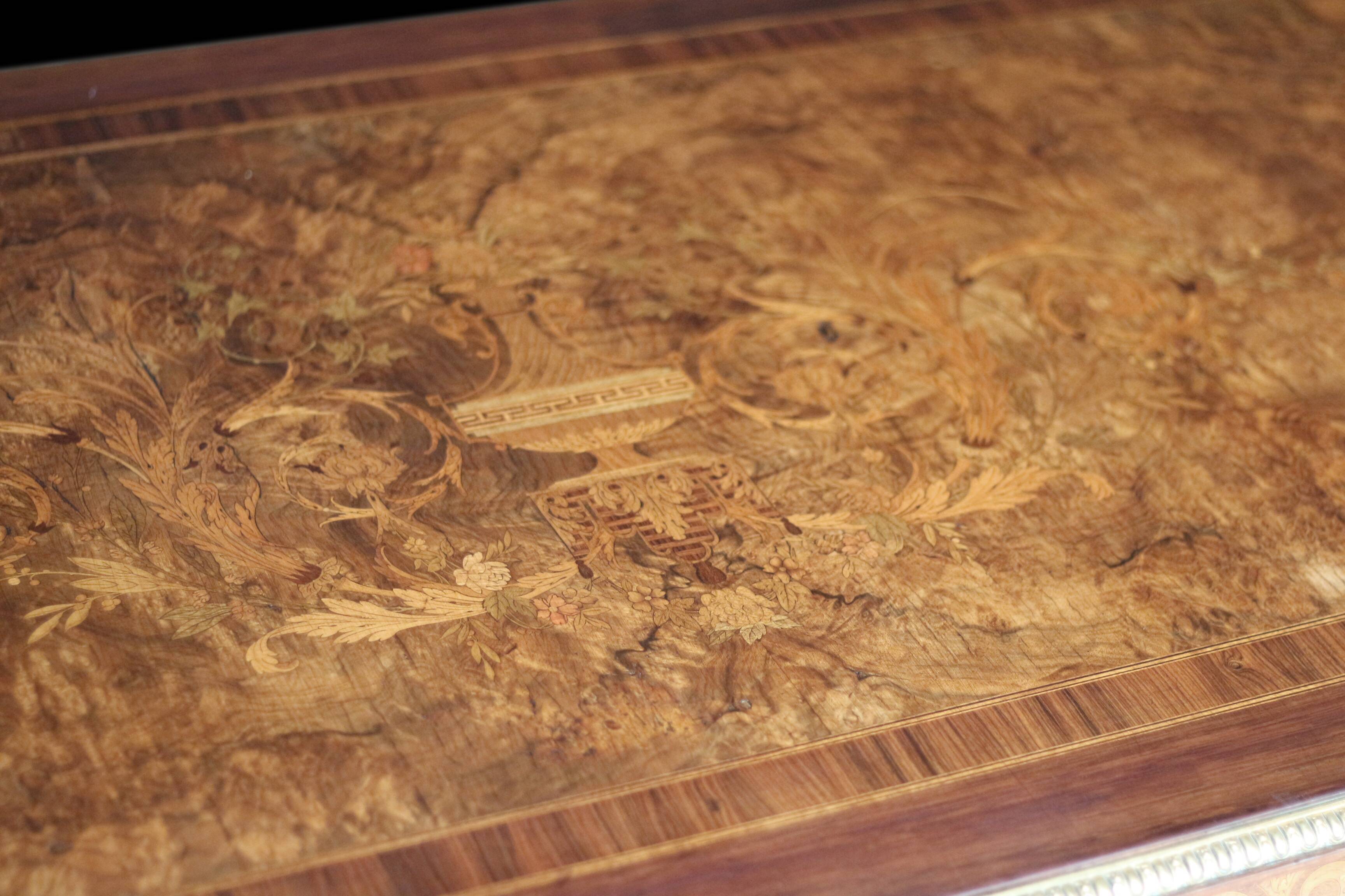 Superb Napoleon III table. Marquetry top and gilded bronzes.
