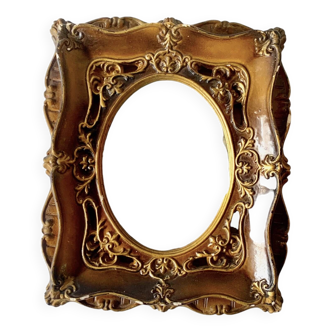 Old plaster wall frame with gilding and curved window