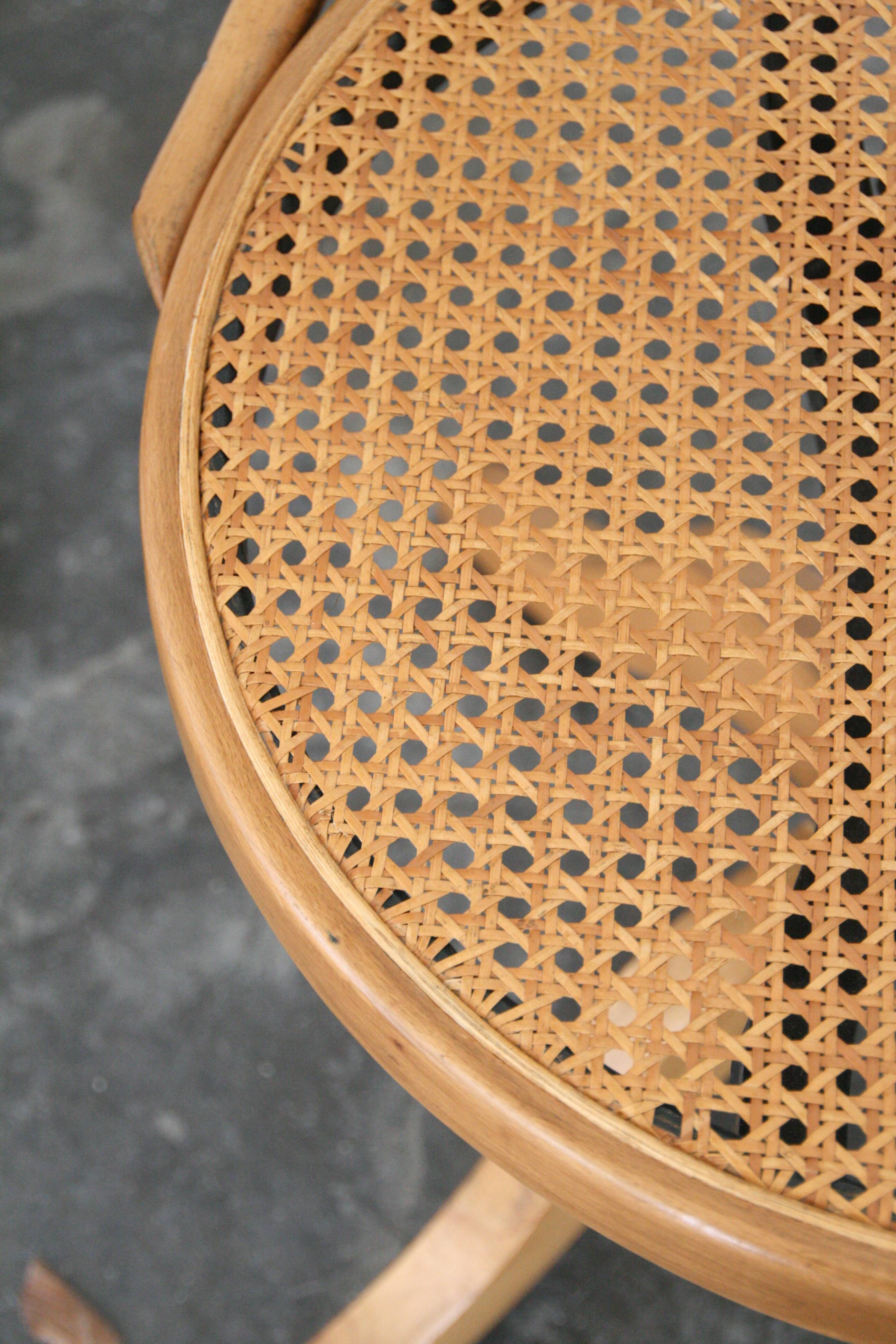 A pair of vintage bent wood svivel chairs by Salvaatore Leone Italy