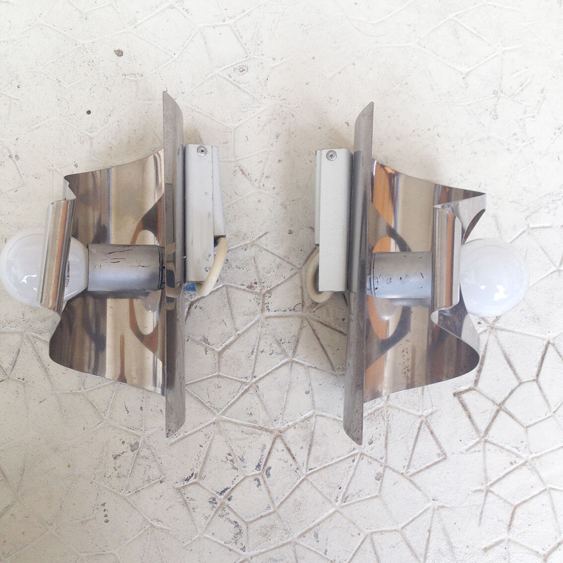 2 metal wall lights from the Maison Sciolari, Italy 1970