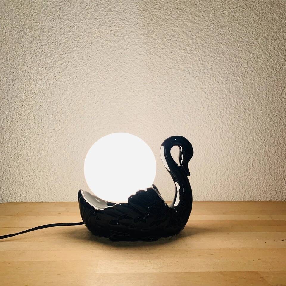 Black ceramic swan lamp with vintage opaline globe