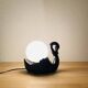 Black ceramic swan lamp with vintage opaline globe