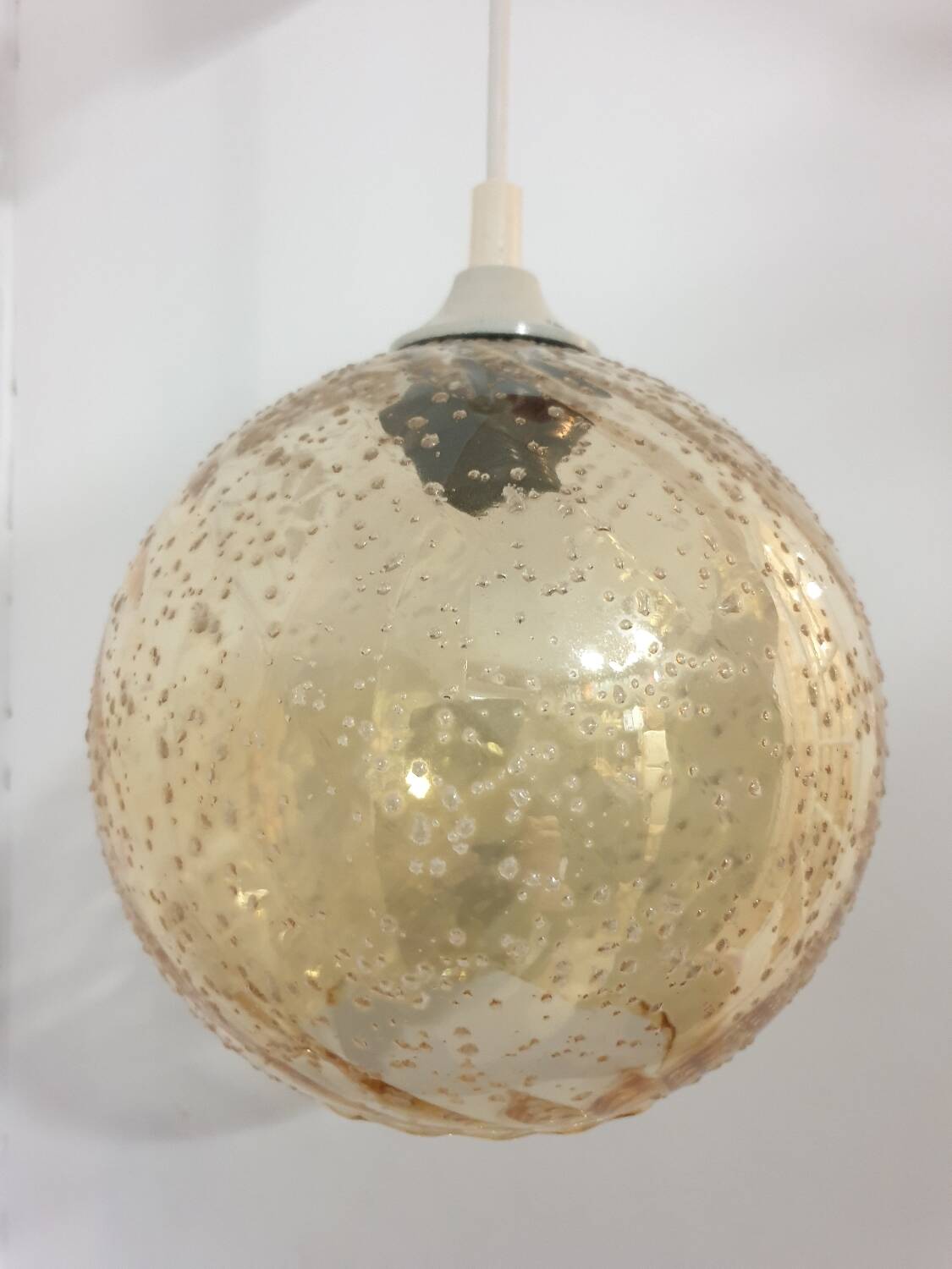 Vintage globe pendant in amber bubble glass