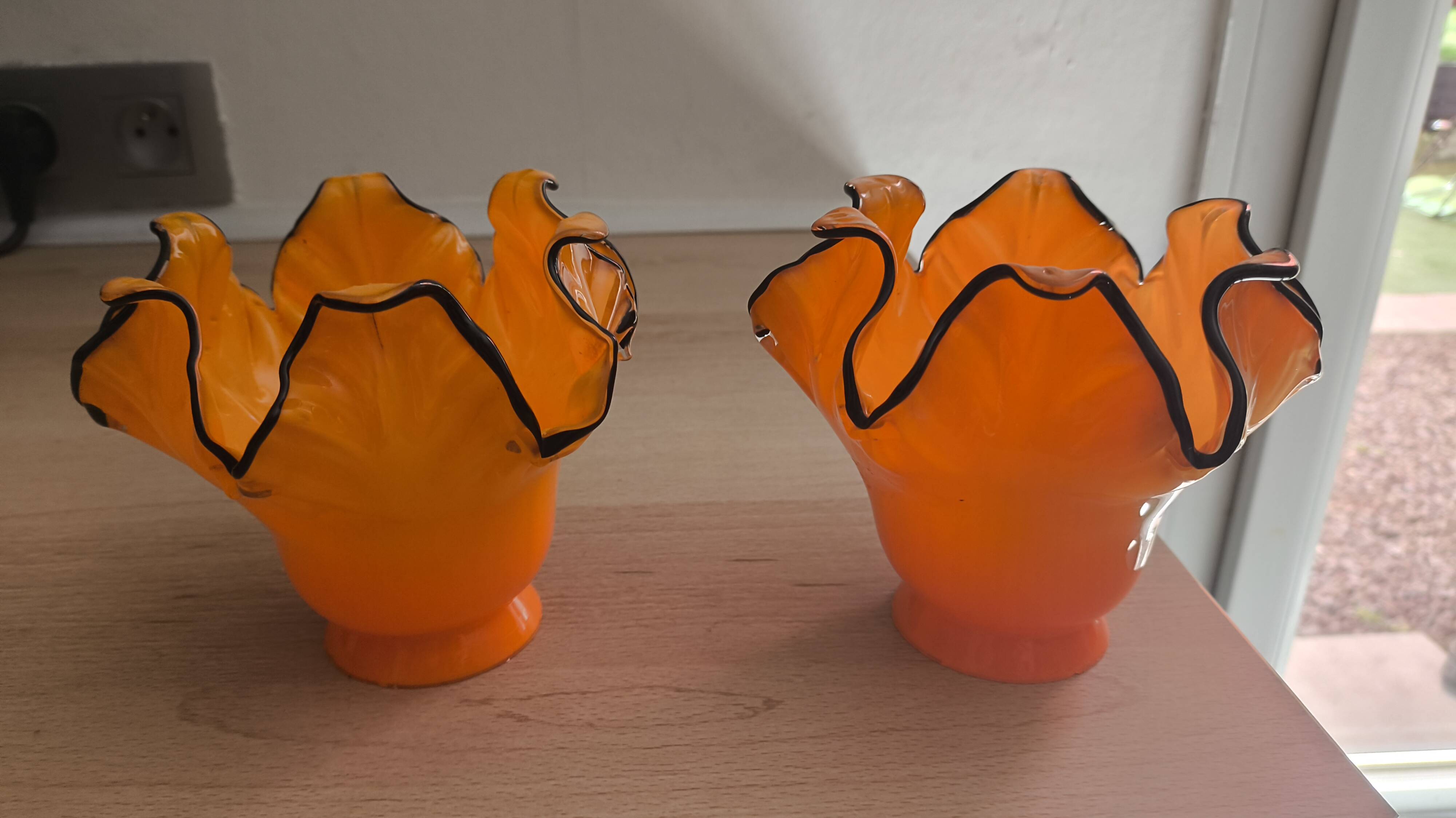 Pair of orange glass tulips with black trim, vintage 70s.