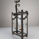 Wrought iron lantern with glass panels, leaf motifs