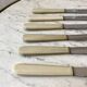 set of 6 white bakelite knives from the 60s