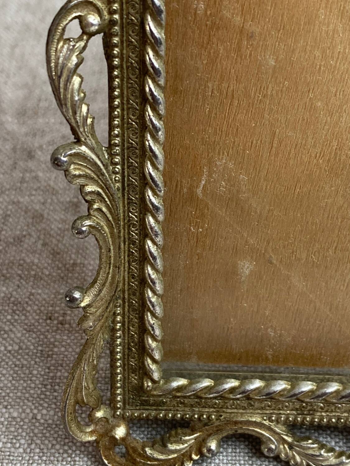Italian gold metal frame on stand