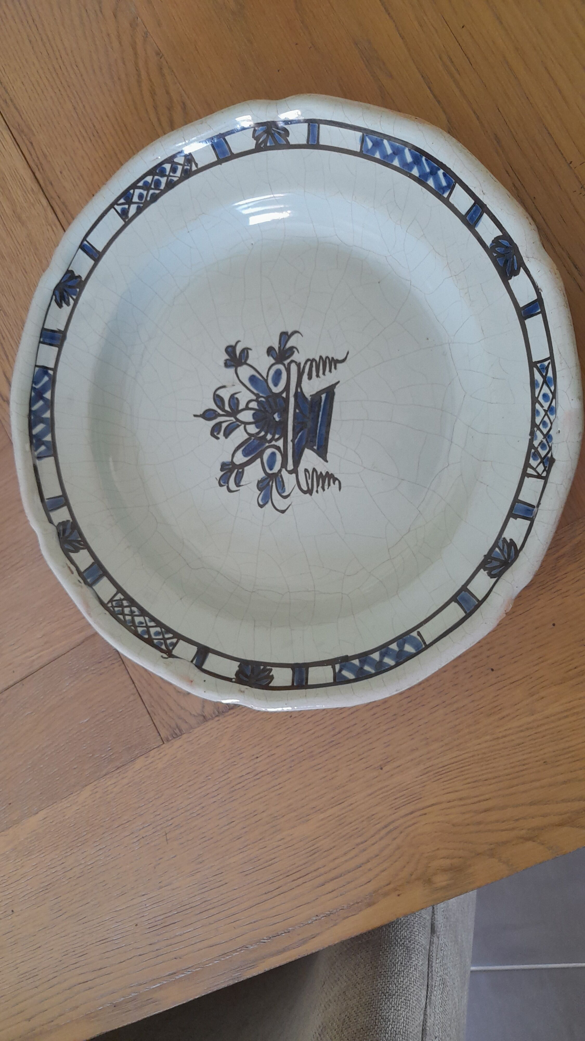 Old round dish in Rouen earthenware