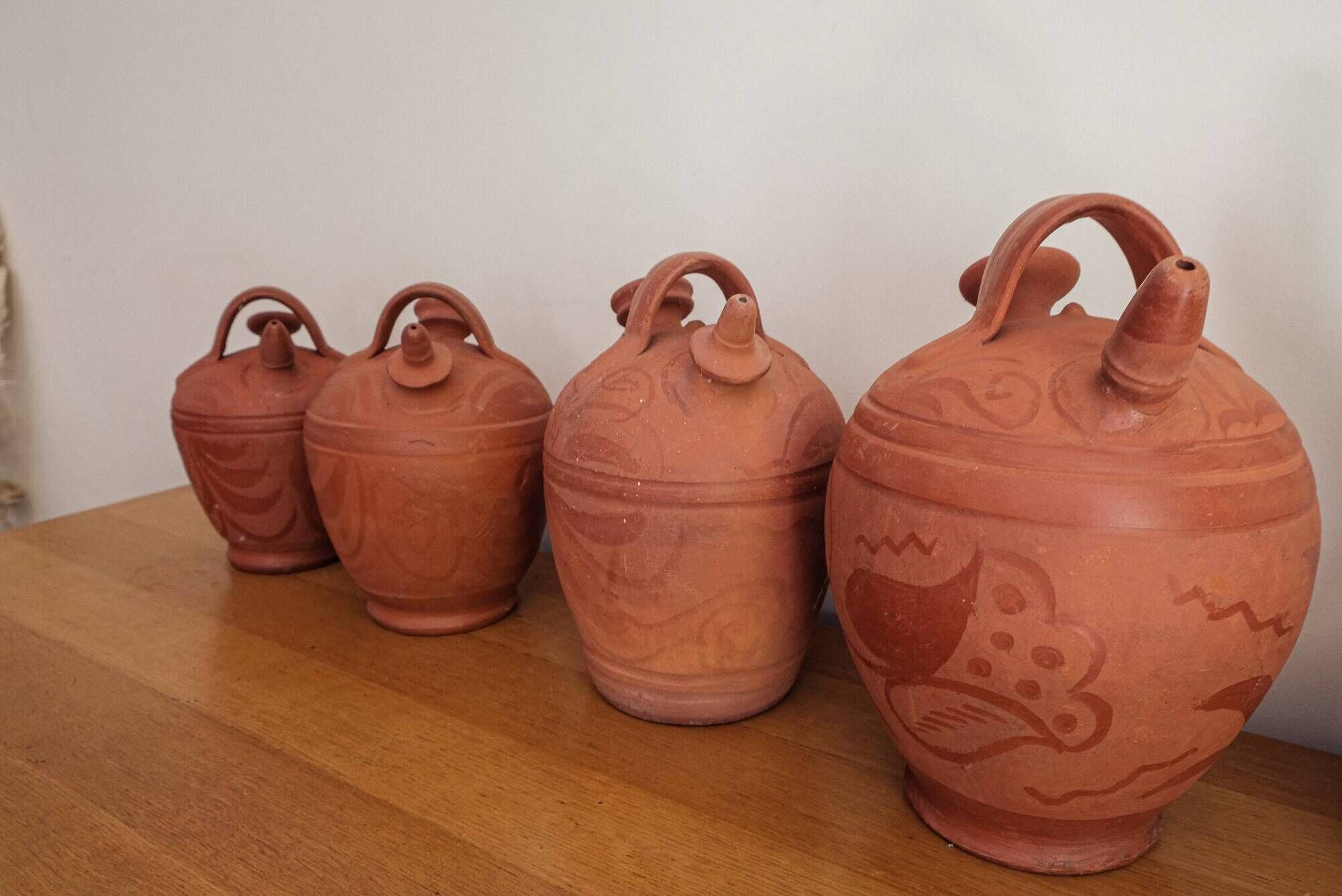 Set of 4 terracotta jugs