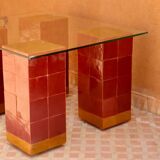 Modern coffee table in burgundy zellige with a tempered glass top.