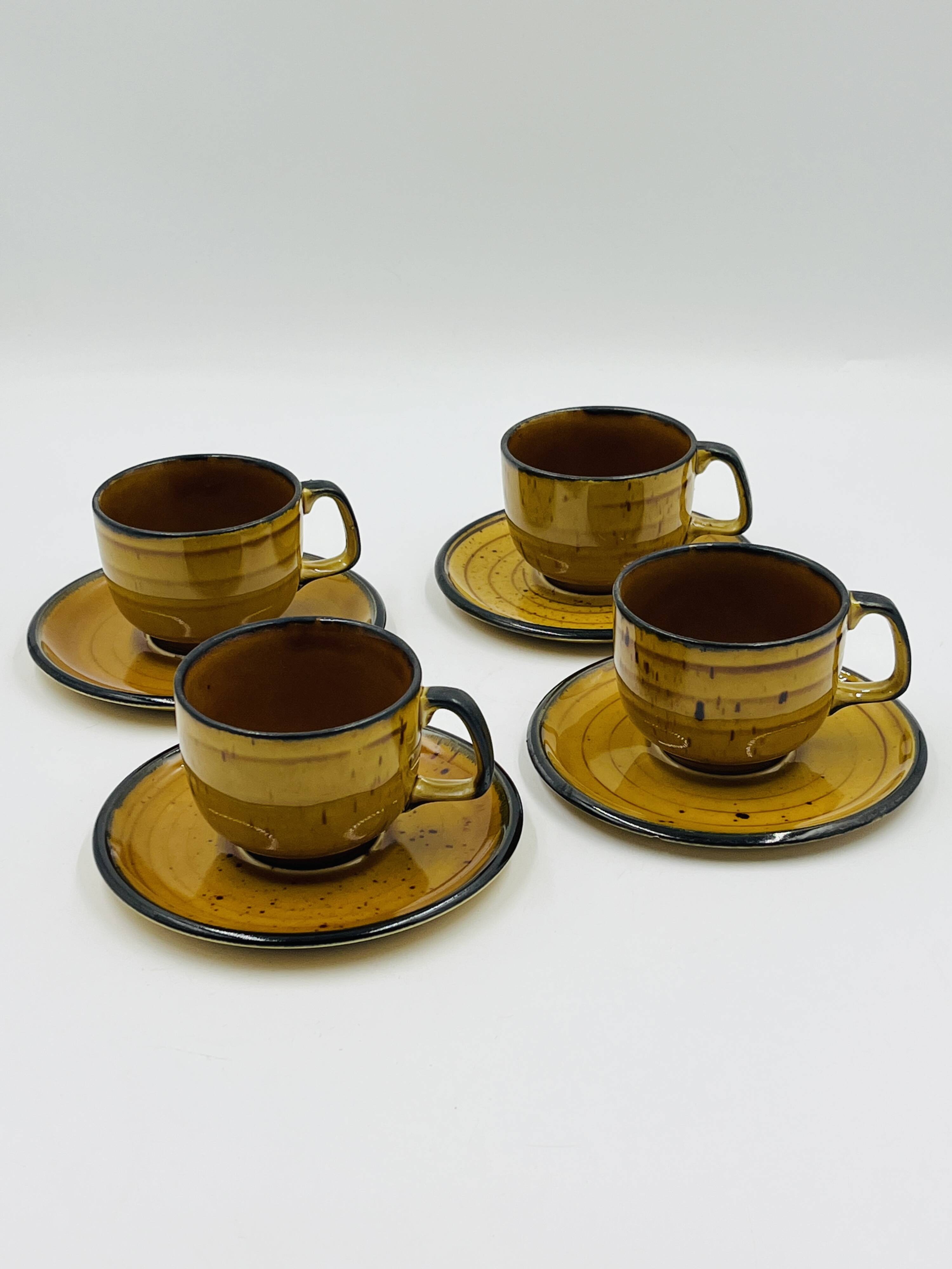 Set of four vintage Boch Palma cups and saucers.