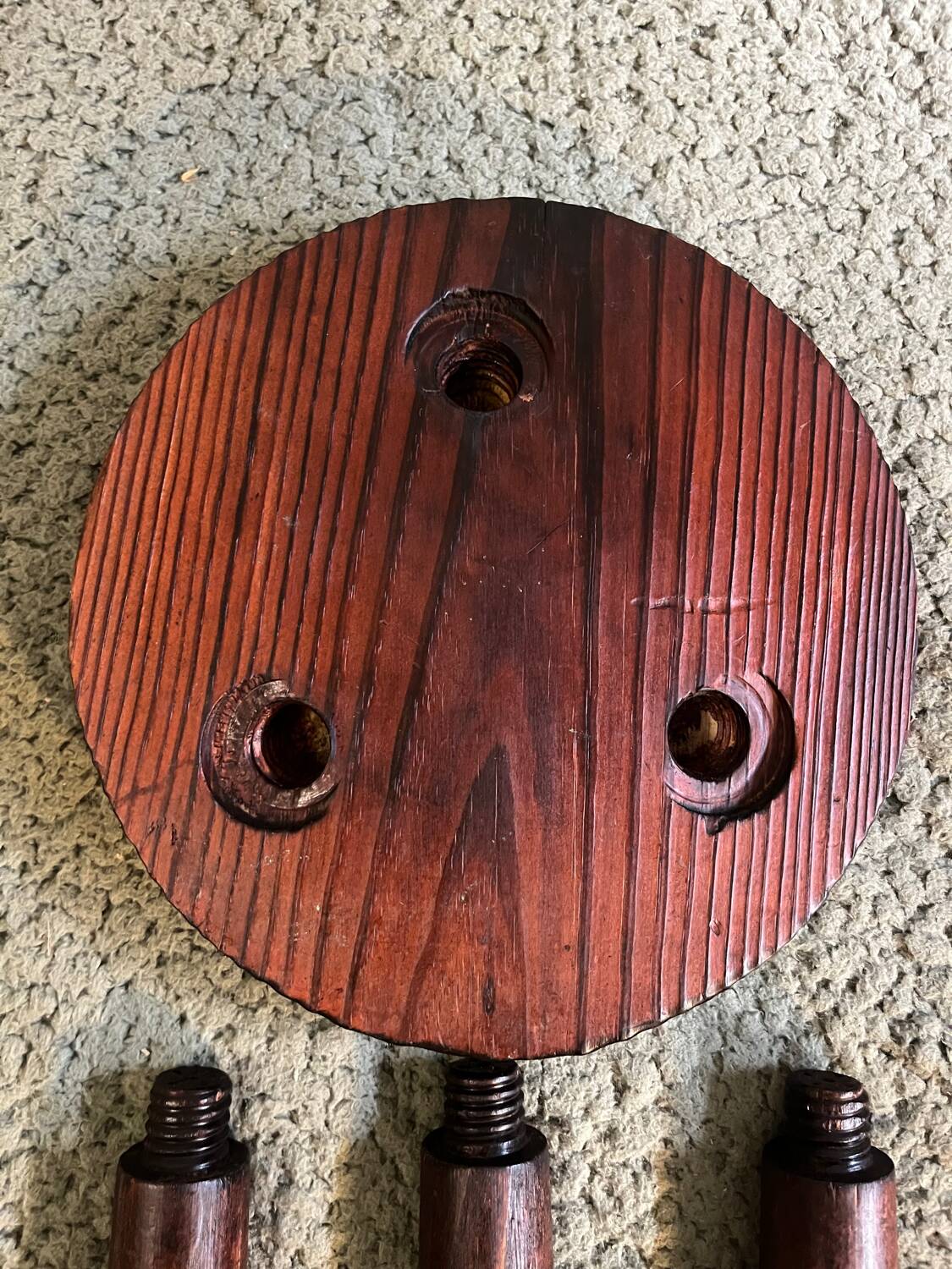 Round wooden tripod stool