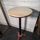 Bistro standing table with marble top and cast iron base.