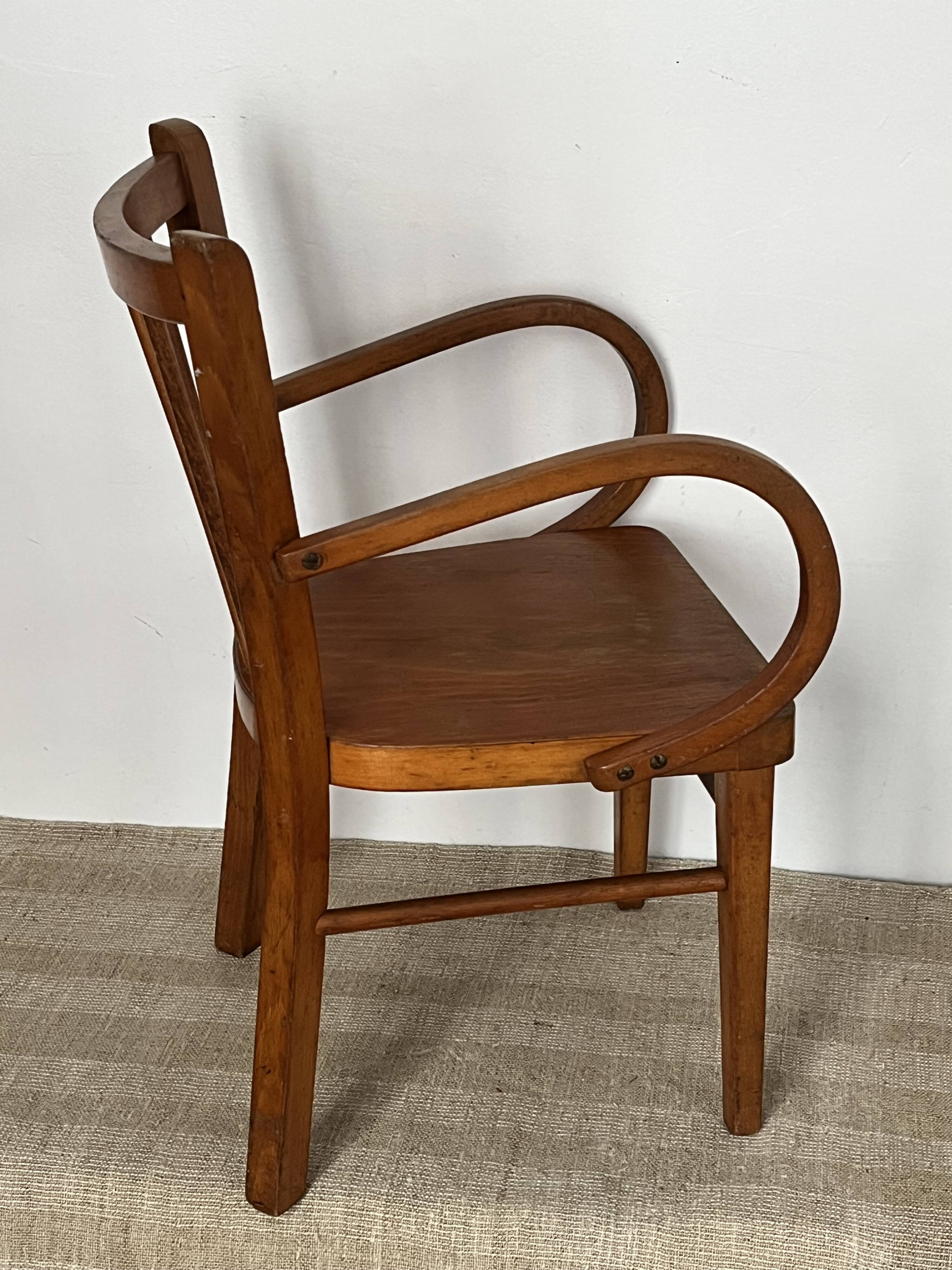 Curved wooden child's armchair - early 20th century