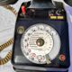 Telephone in black bakelite dial with call system