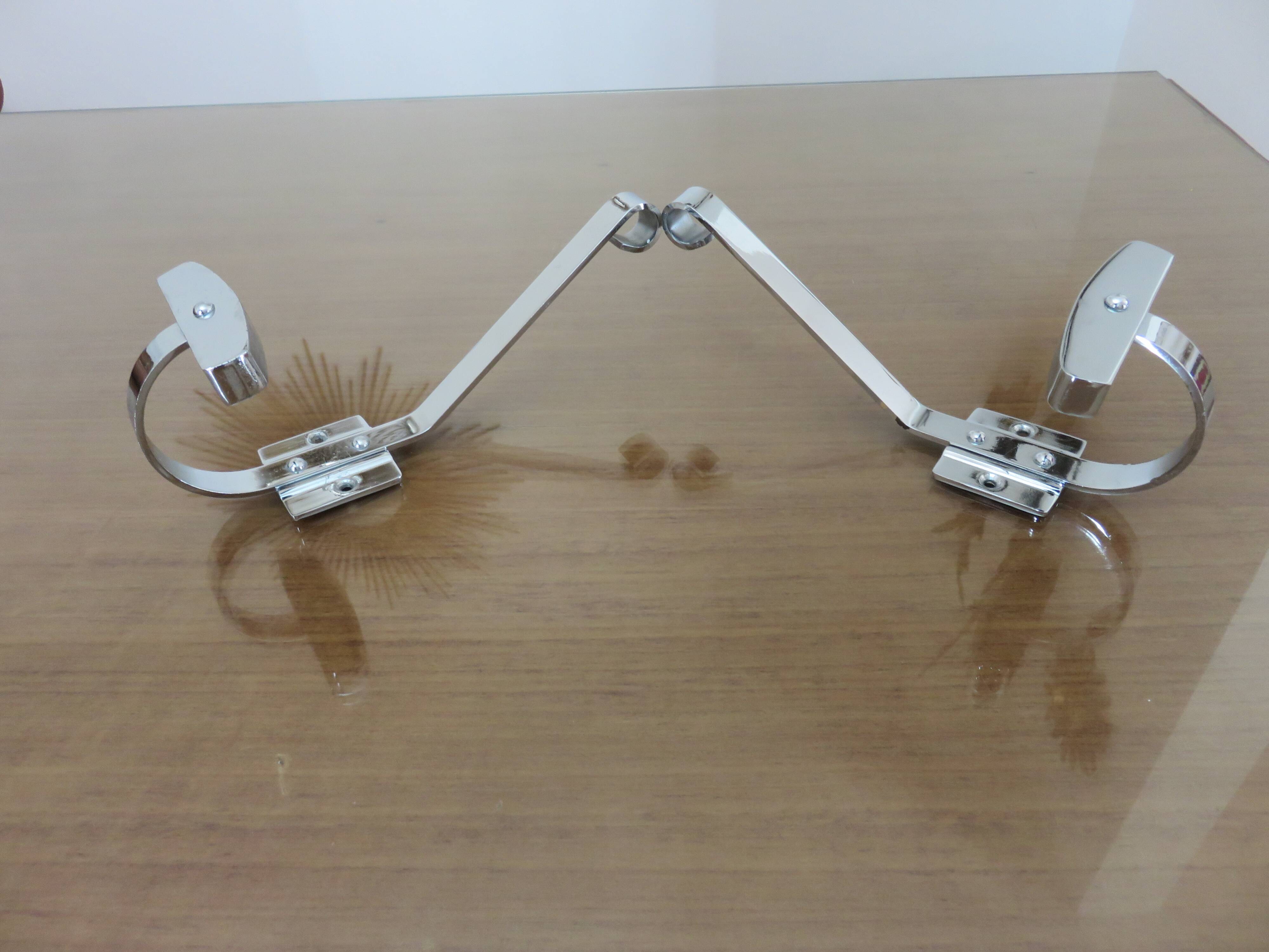 Pair of chrome metal coat hooks from the 1970s.