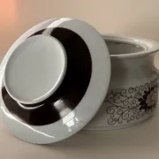 Porcelain soup tureen by Winterling, decorated with brown flowers.