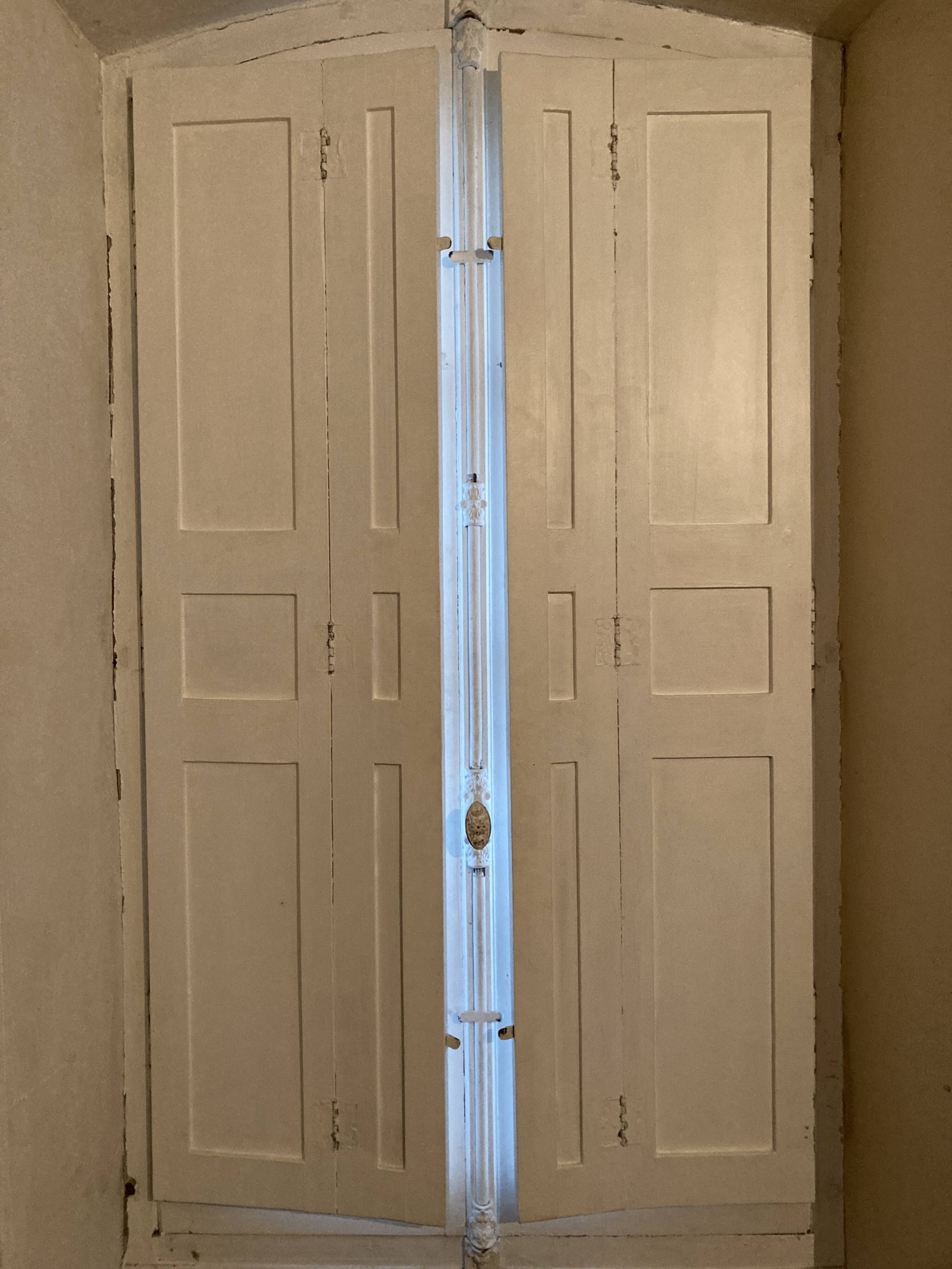 Window with interior shutters