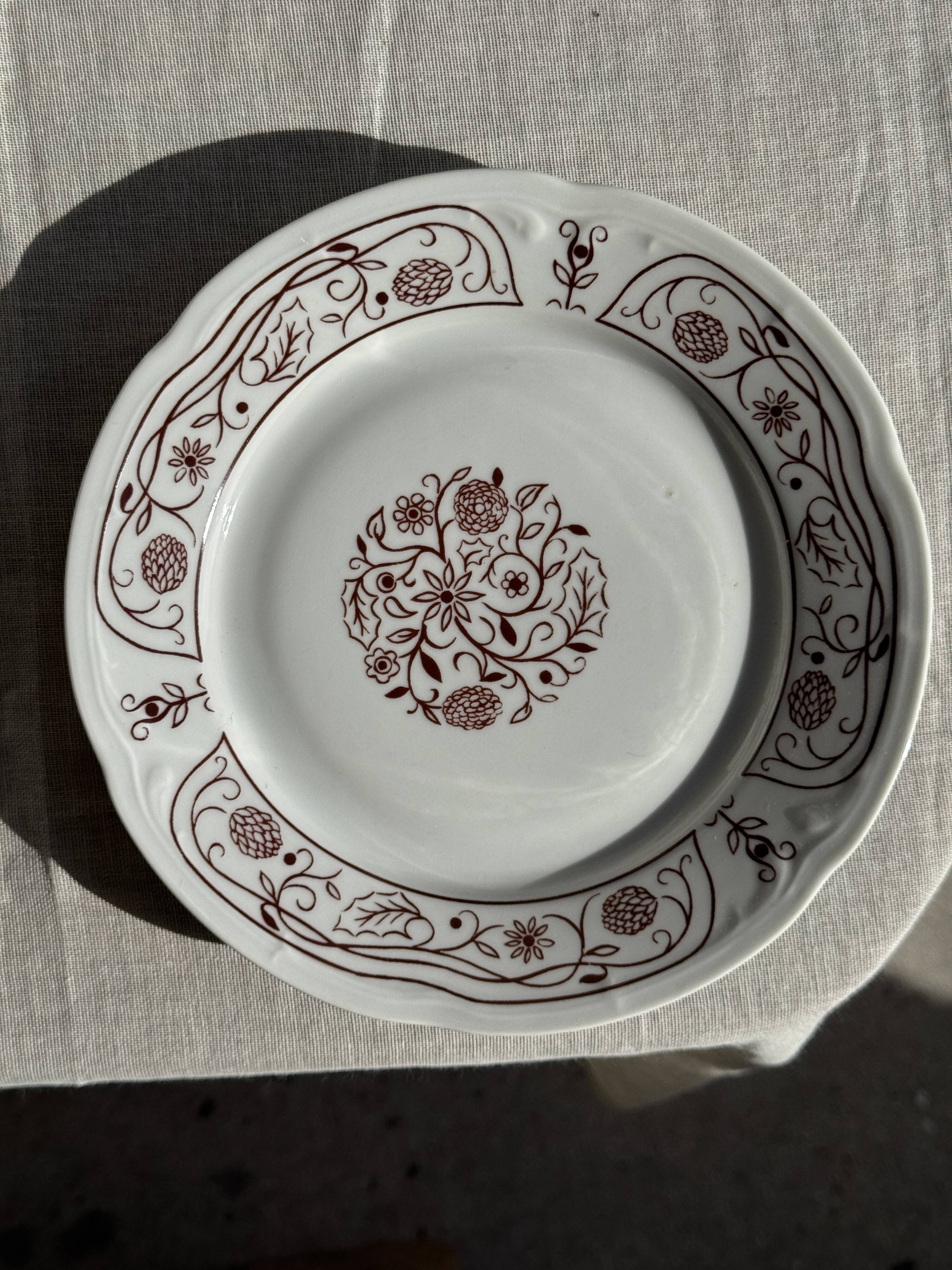 Set of 6 vintage dessert plates made in Poland with a plant motif.