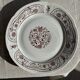Set of 6 vintage dessert plates made in Poland with a plant motif.