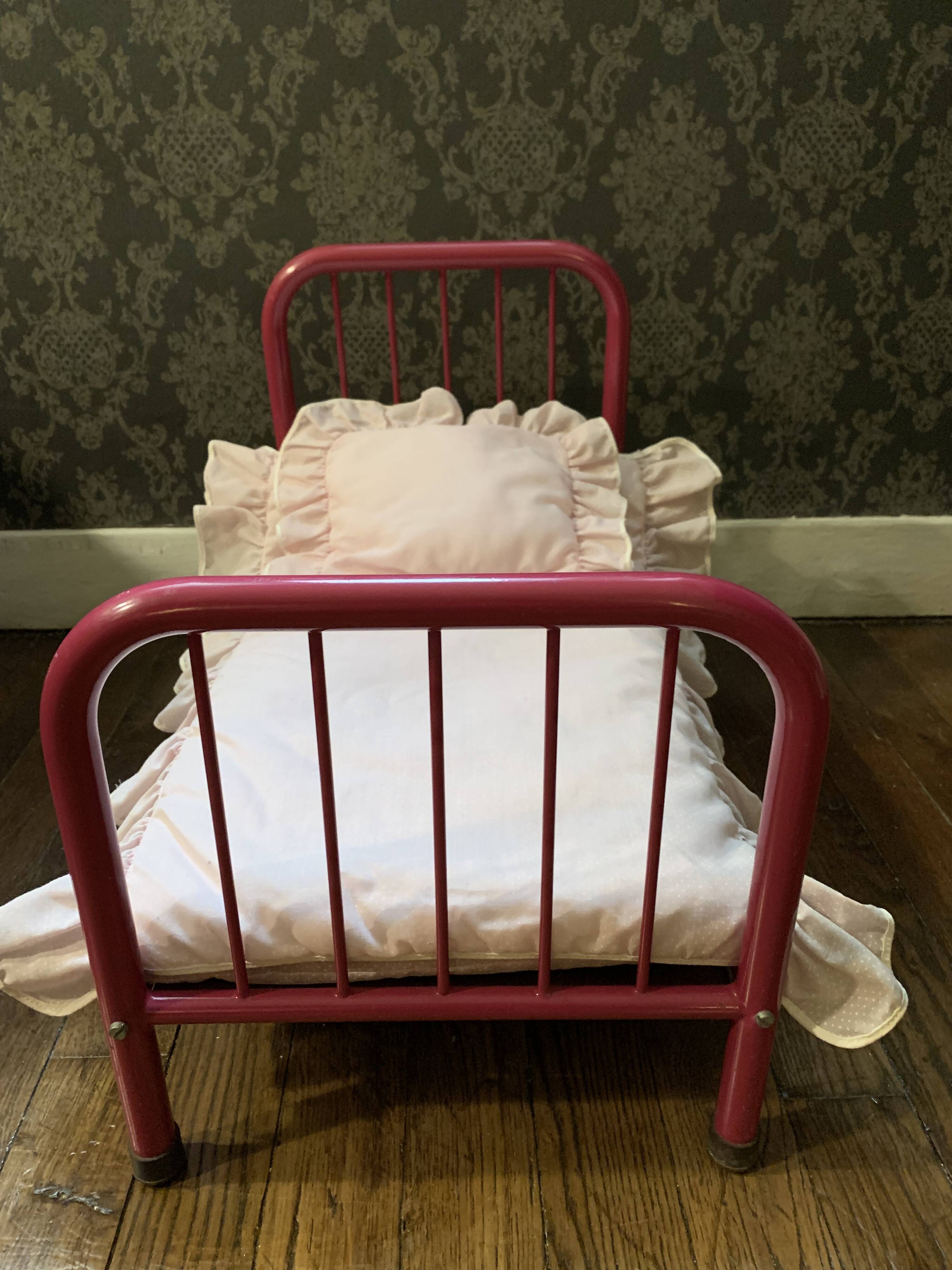 pink metal doll bed