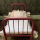 pink metal doll bed