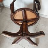 Thonet armchair, swivel, in wood and faux leather.