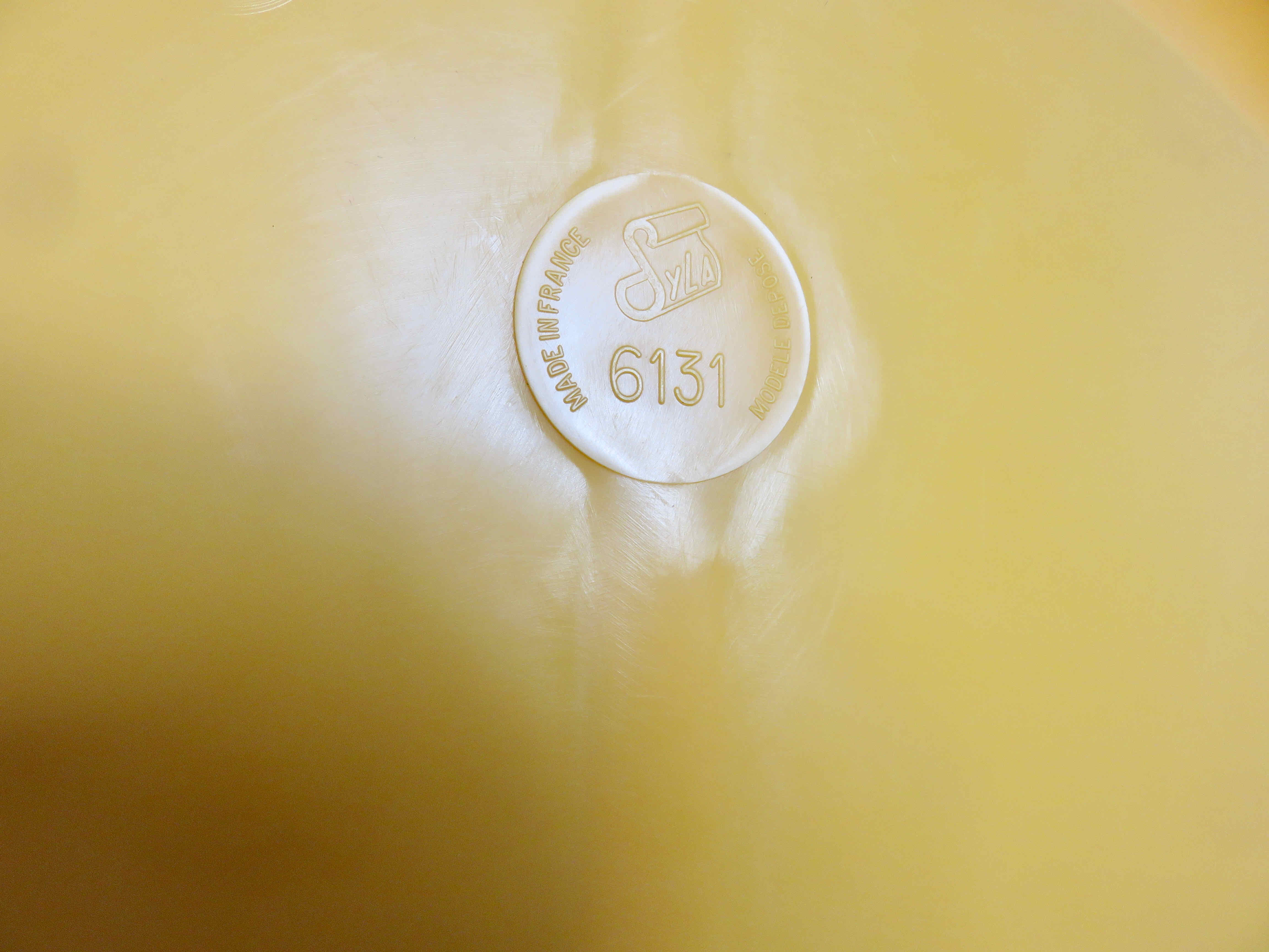 Round wall mounted mirror in yellow plastic 1970