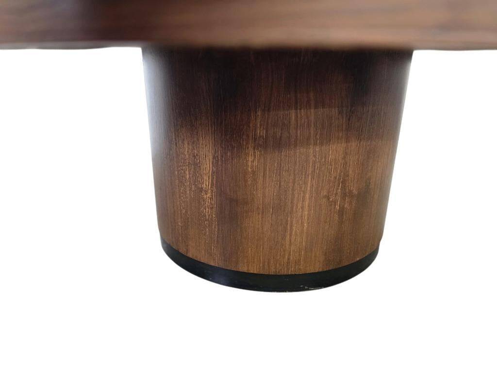 Vintage round wooden coffee table with a copper top.