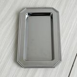 Small rectangular tray made of lightweight metal.