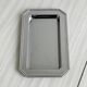 Small rectangular tray made of lightweight metal.