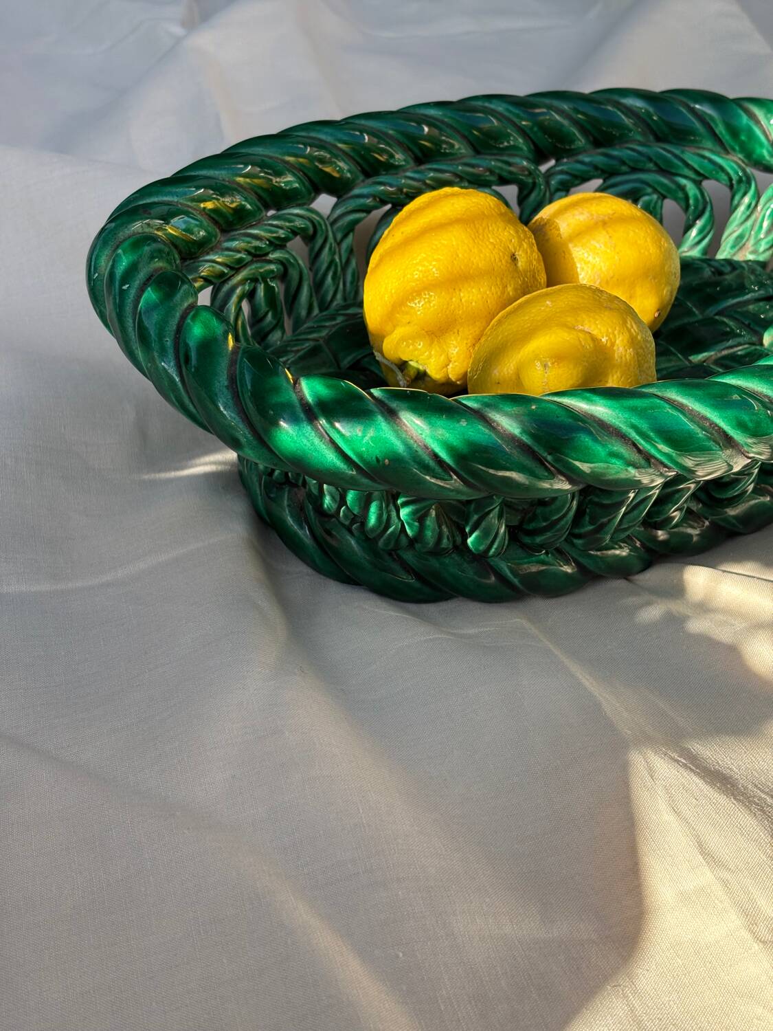 Green woven ceramic basket