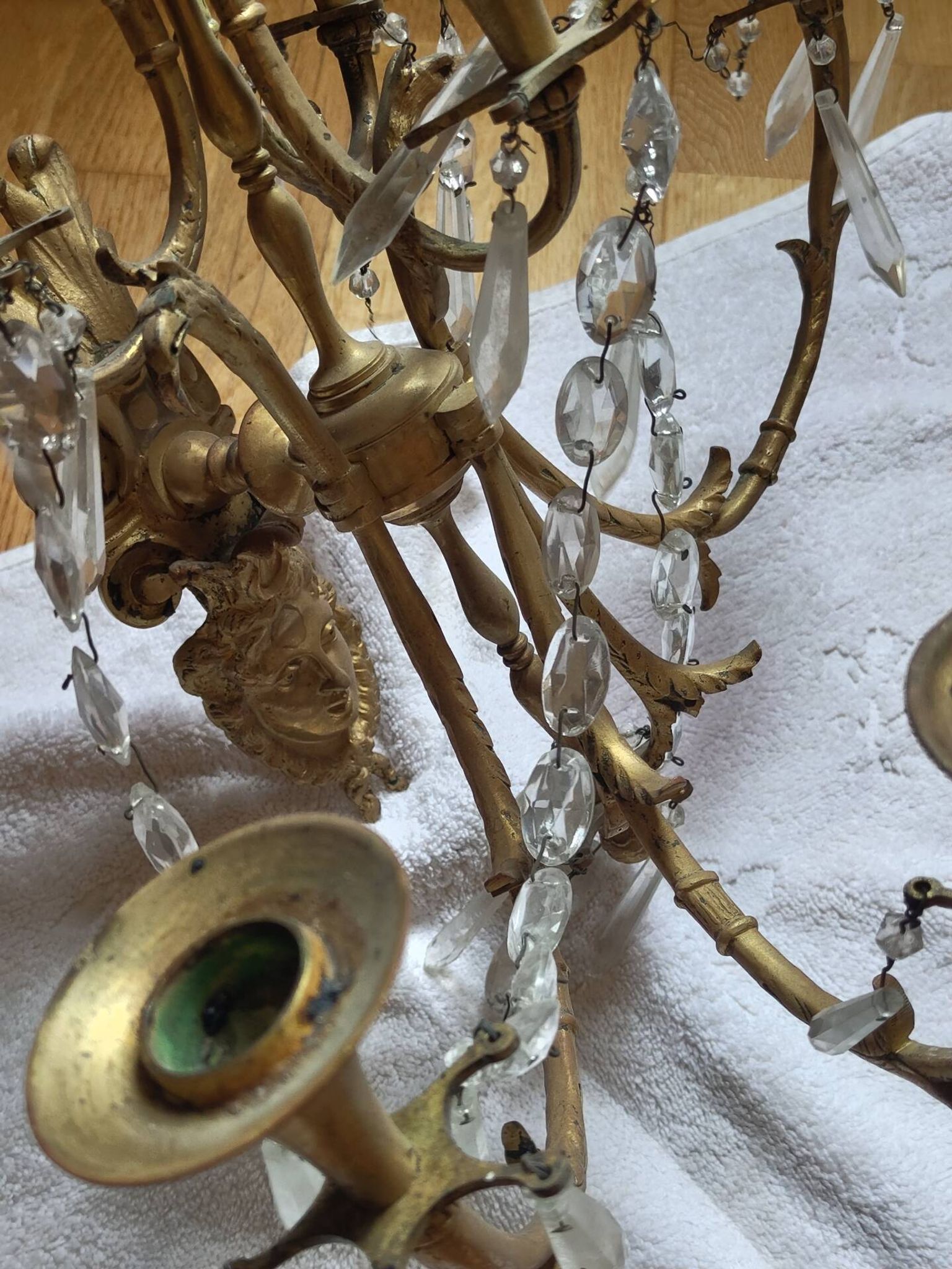 Gilded bronze wall lights with crystal pendants