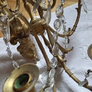 Gilded bronze wall lights with crystal pendants