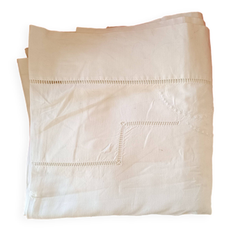 White sheet: reverse with embroidery and handmade stitching.