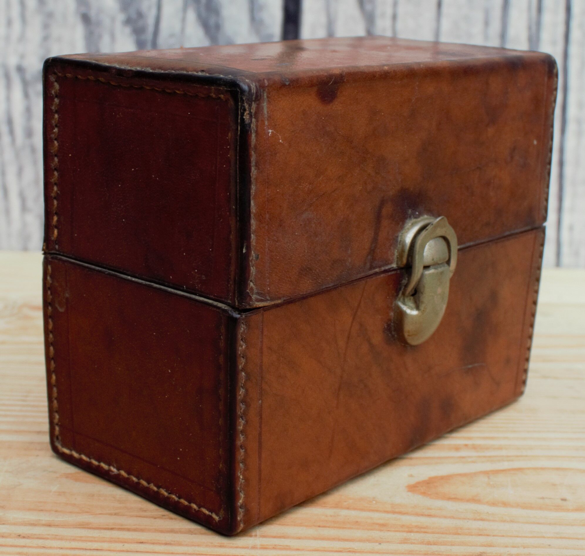 Antique leather case with 3 beveled bottles