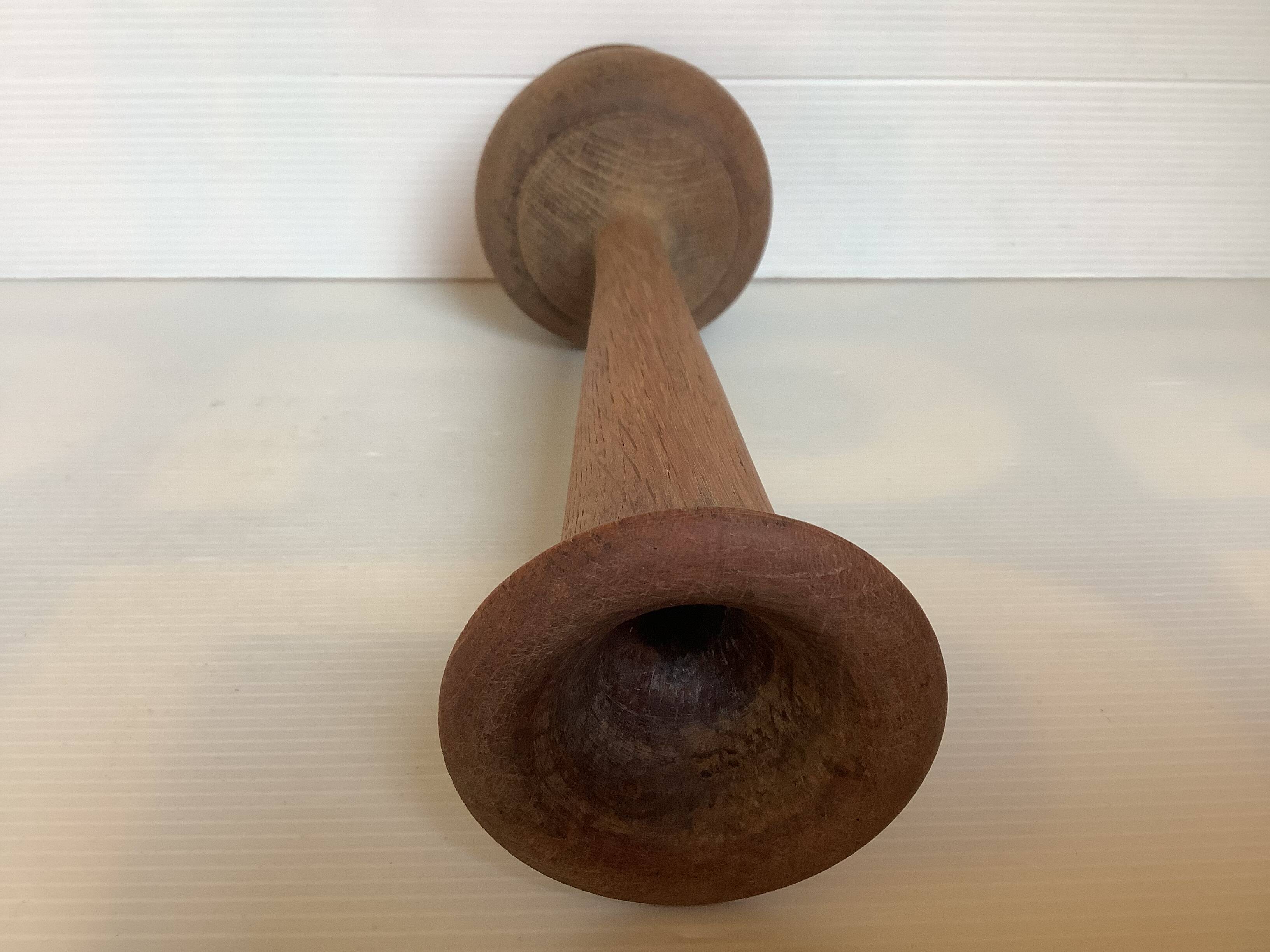 Old trumpet-shaped wooden vase